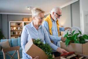 Elderly couple unpacking at a senior living community