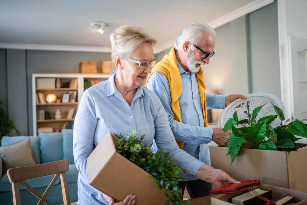 Elderly couple unpacking at a senior living community